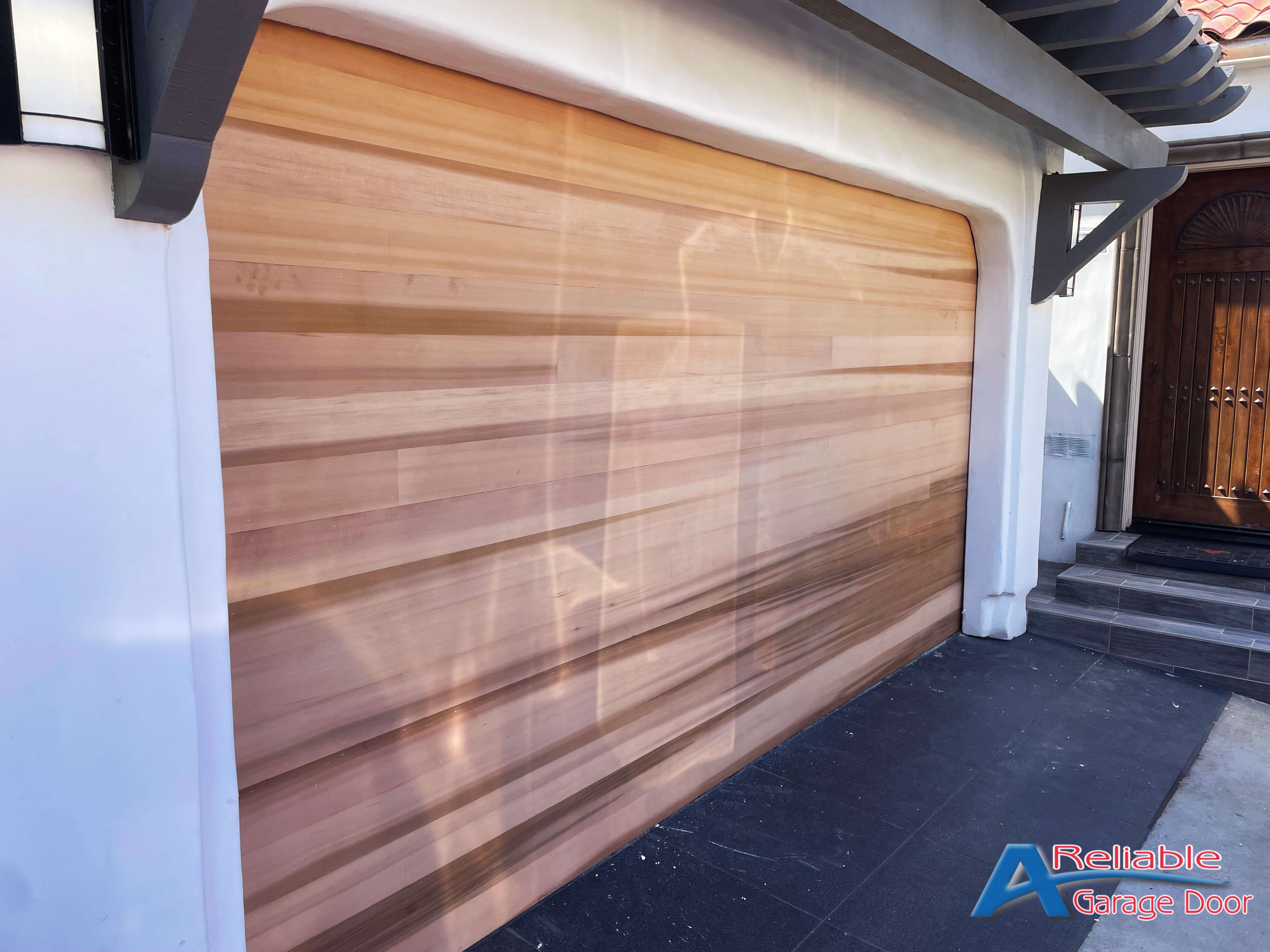 Elegant Western red cedar garage doors installed in La Jolla