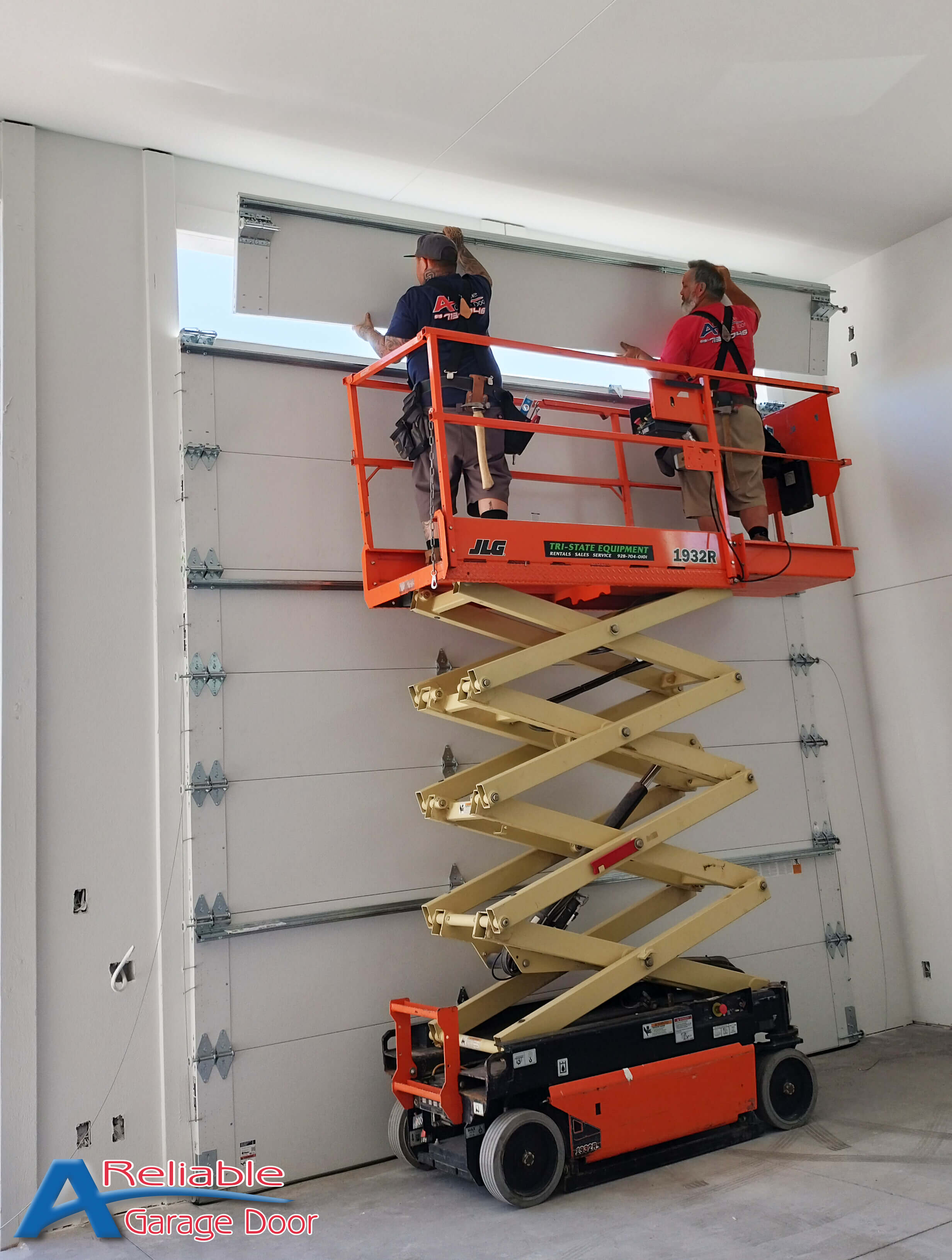 A Reliable Garage Door technicians replacing a snapped torsion spring