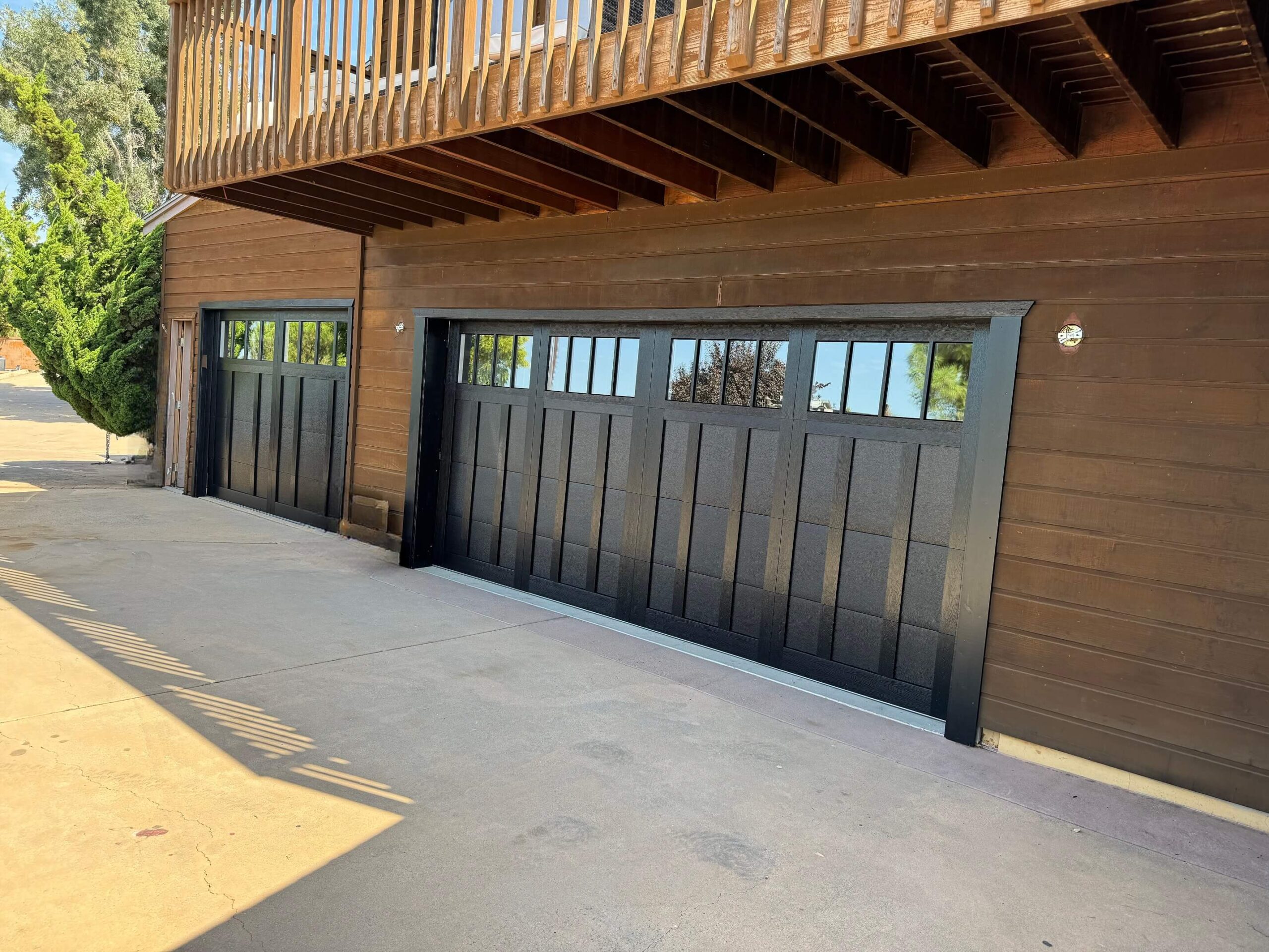 Newly installed C.H.I. overlay garage doors on a home in Alpine, CA, by A Reliable Garage Door.